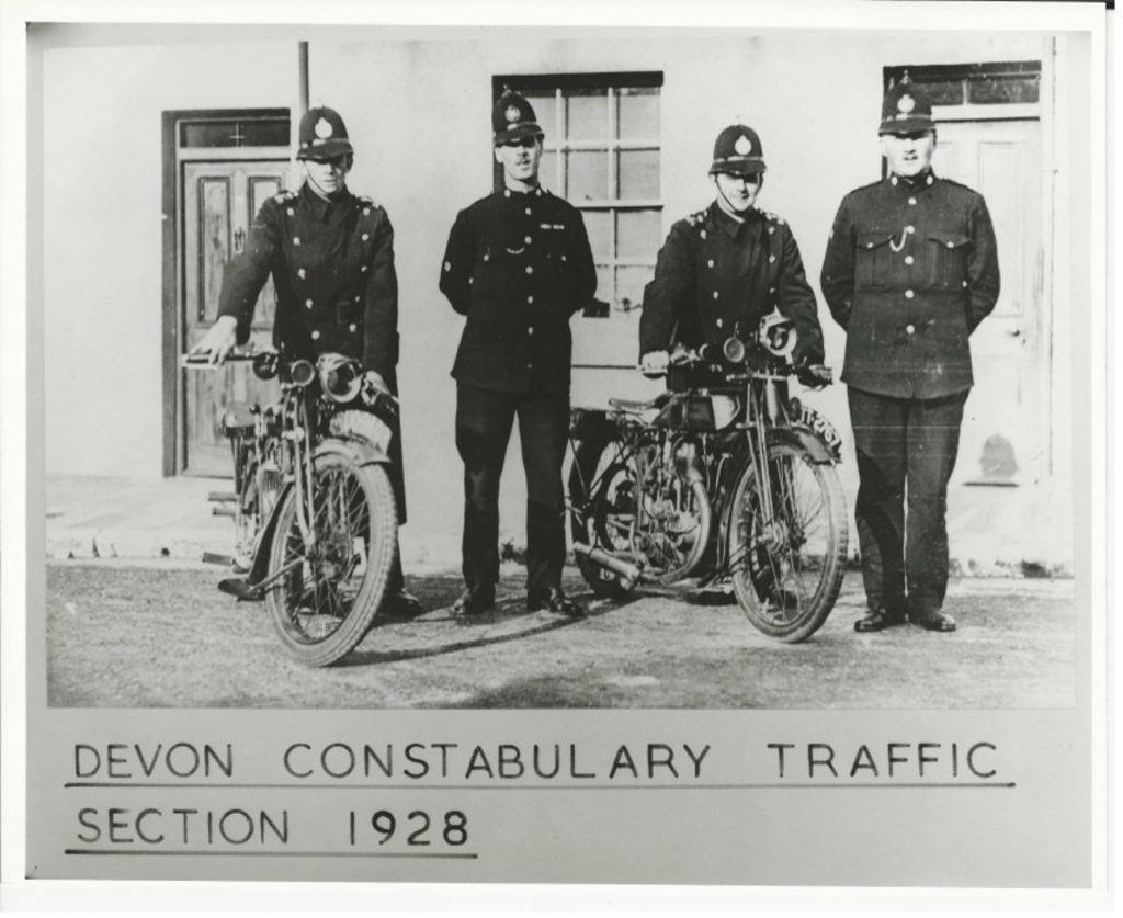 Four policemen and two motorcycles, comprising the entirety of the Devon Traffic section in 1928.